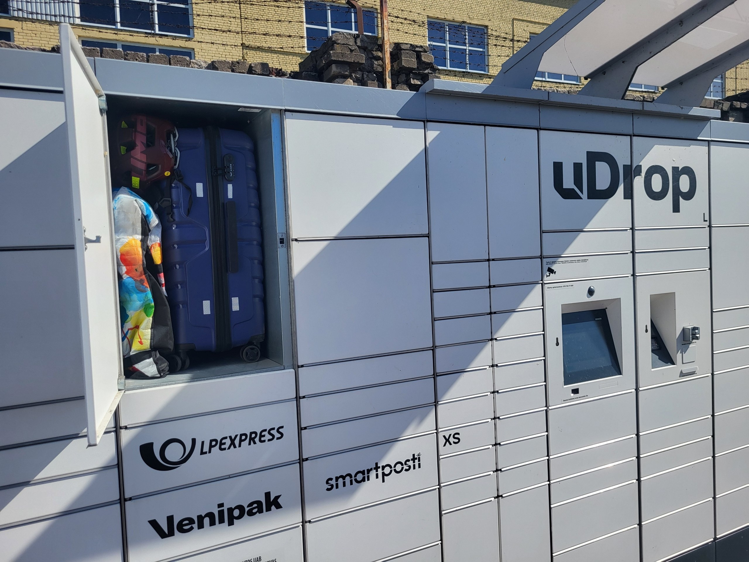 Suitcase in an uDrop package locker with a few extra items.